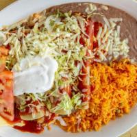 Enchiladas El Mariachi · Four enchiladas, one beef, one cheese, one chicken and one bean, topped with cheese, enchila...