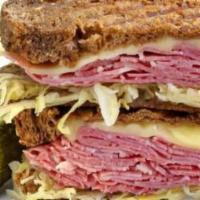 Corned Beef Sandwich · Includes lettuce, tomato, onion, mayo and mustard.