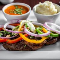 Rib Eye Steak · A juicy cut of rib eye steak marinated and charred any way you like and served with sides of...