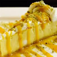 Mango Cheesecake · Recommended. Creamy mango cheesecake set on a ginger cookie crust. Topped with whipped cream...