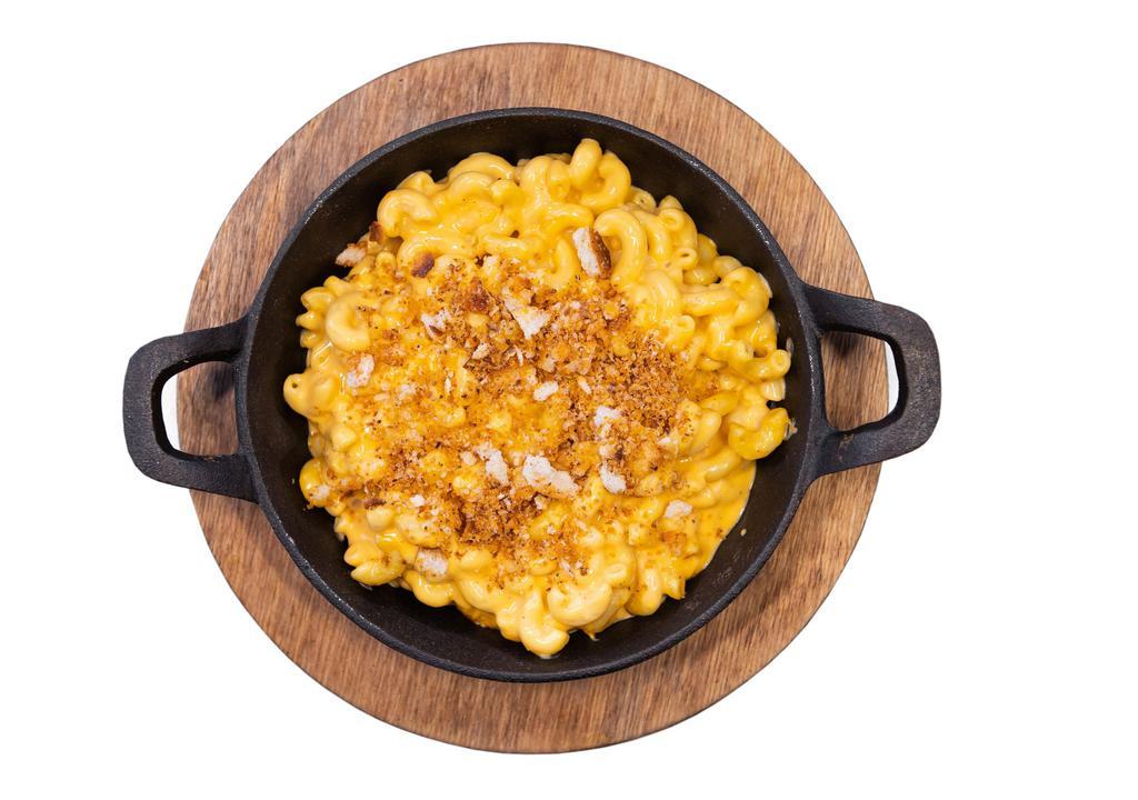 Mac & Cheese (Individual) · A classic blend of cheddar cheeses, cream, and elbow macaroni. Baked with shredded smoked gouda and a sprinkle of bread crumbs.