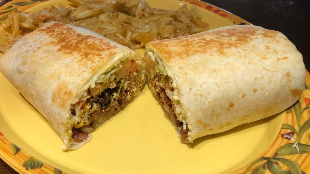 Supremo Burrito · Choice filling, rice, sour cream, lettuce, tomato, beans, cheese.