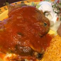 Chiles Rellenos App (2) · 2 chiles rellenos topped with ranchero sauce and choice tortillas