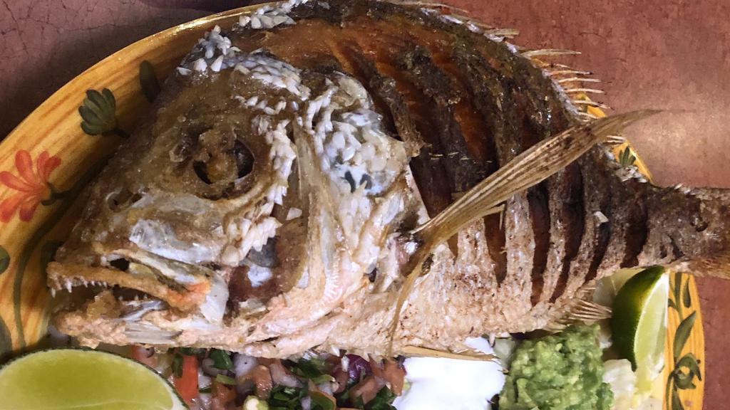 Huachinango (Whole Red Snapper) · Deep-fried whole red snapper, served with salad, rice, beans, tortillas.