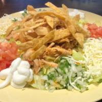Taco Salad · Your choice of taco filling, lettuce, refried beans, cheese, tomato,  sour cream, onion/cila...