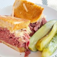 Reuben · Corned beef, swiss cheese, and sauerkraut, grilled to a golden brown on rye bread.
