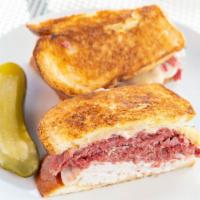 Marilyn · Corned beef and turkey with swiss cheese and Russian dressing grilled on rye.