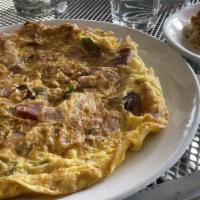 Western Omelette · Stuffed with green peppers, corned beef and onions.