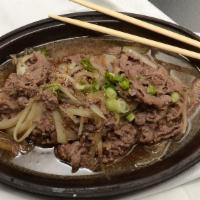 Bulgogi · Thin, marinated slices of beef grilled on a stove-top griddle.