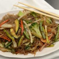 Japchae · Sweet glass noodles with beef and vegetables.