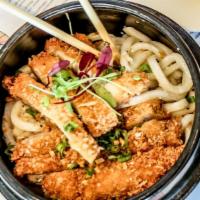 Chicken Longevity Noodles · Crispy chicken, garlic butter noodles.