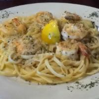 Shrimp Scampi · Sautéed shrimp, garlic & lemon with white Wine sauce over linguini pasta