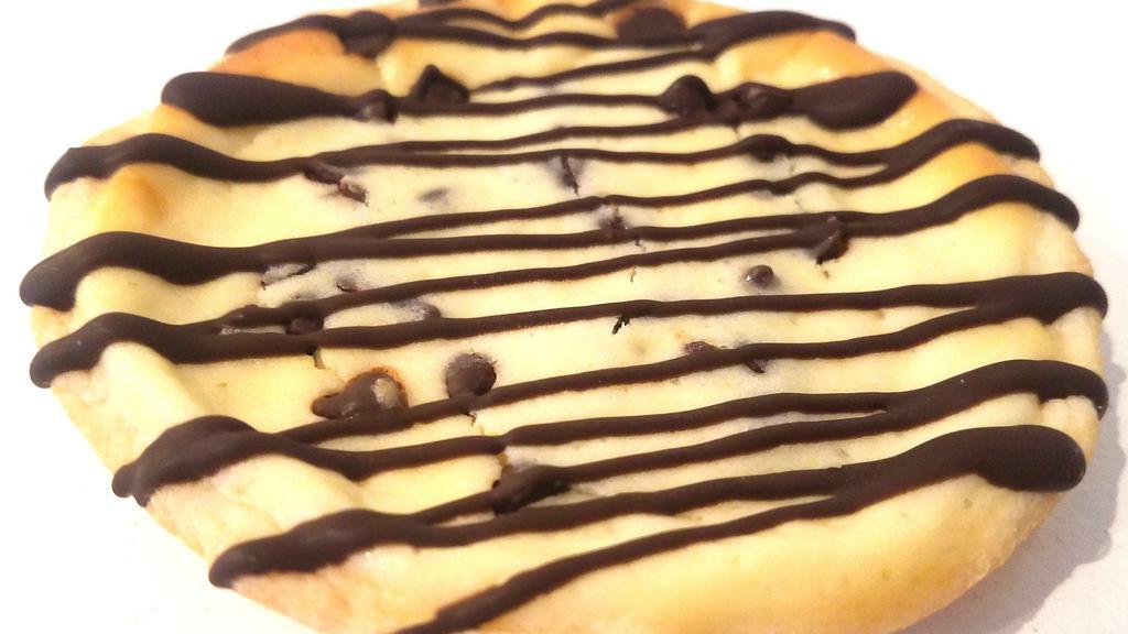 Chocolate Chip Cheesecake Cookie · Pastry Cookie filled with vanilla chocolate chip cheesecake and topped with a chocolate drizzle.