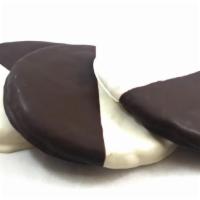 Black & White · Our handmade butter cookie, dipped one half in vanilla white chocolate and the other half in...