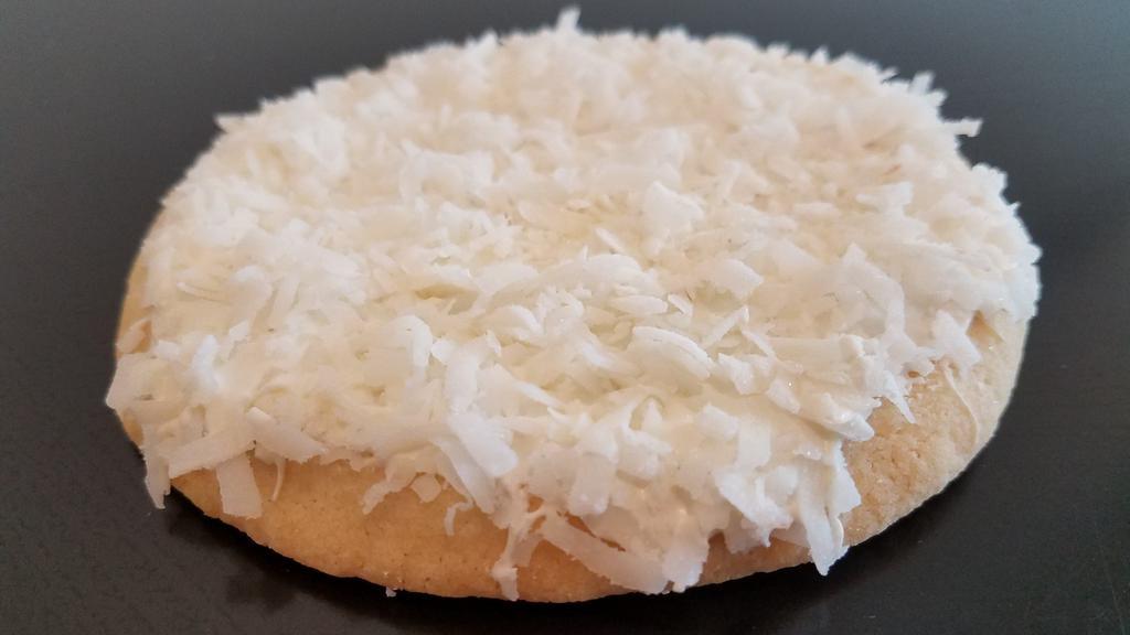 Coconut & White Chocolate · Our classic Butter Cookie topped with layer of vanilla white chocolate and covered in shredded coconut.