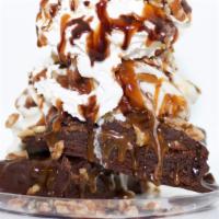 Turtle Brownie Sundae · Our turtle brownie, warmed up with vanilla soft serve on top, then topped with caramel, choc...