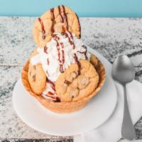 Chocolate Chip Waffle Bowl Sundae · Our soft serve vanilla bean ice cream served in a waffle bowl, topped with chocolate, whippe...