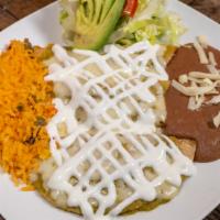 Enchiladas · Three soft corn tortillas stuffed with chicken, cheese, rice, beans, lettuce and tomato.