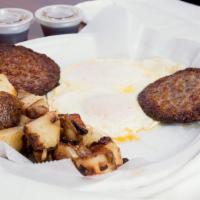 Waffle Breakfast · 2 eggs, meat, grits or fried potatoes.
