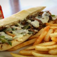 Philly Cheese Steak · Served with fries.