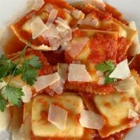 Ravioli · Pasta stuffed with six cheeses, served with our marinara tomato sauce. Served with our house...
