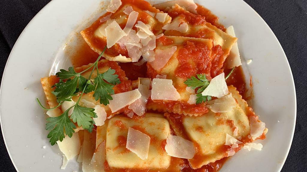 Ravioli · Pasta stuffed with six cheeses, served with our marinara tomato sauce. Served with our house bread.