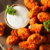 Boneless Buffalo Wings · Boneless! Oven-baked chicken wings crispy to perfection topped with spicy buffalo sauce. Ser...