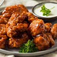 Boneless Bbq Wings · Boneless! Oven-baked chicken wings crispy to perfection topped with sweet BBQ sauce. Served ...