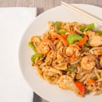 Udon Noodle Spicy · Hot. Udon noodle with chicken, shrimp, egg onion, green & red bell pepper and basil in brown...
