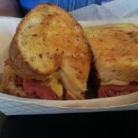 Pastrami On Grilled Rye · Swiss cheese and mustard.