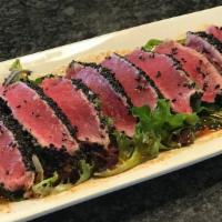 Tuna Tataki · Seared tuna, mixed greens, spicy Goma sauce.