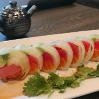 Naruto · Fresh. Inside: chef's choice sashimi, avocado, kani. Outside: wrapped in cucumber, ponzu sau...