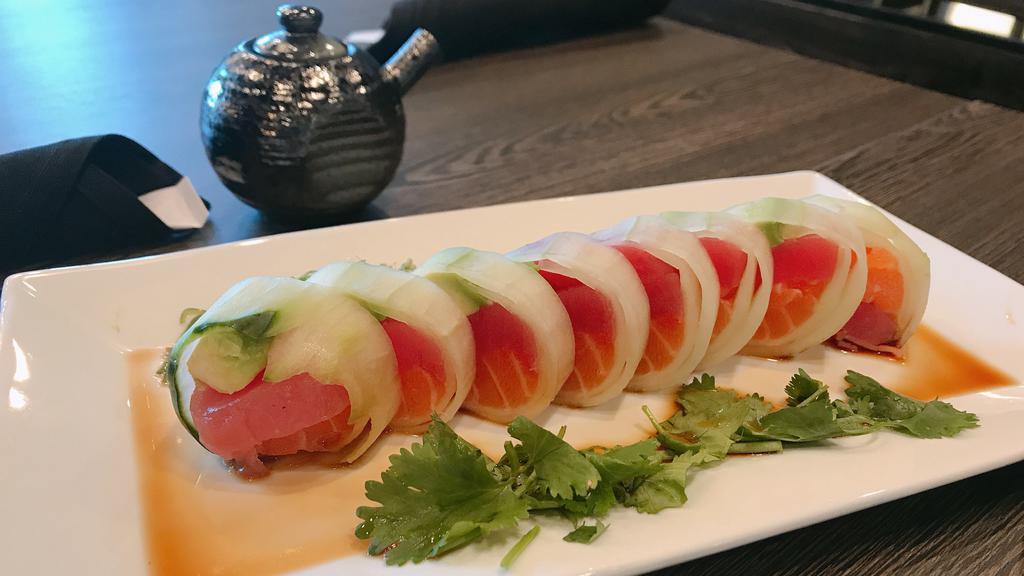 Naruto · Fresh. Inside: chef's choice sashimi, avocado, kani. Outside: wrapped in cucumber, ponzu sauce.