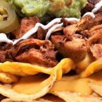Al Pastor Nachos · Classic al pastor nachos with melted cheese, pico de gallo, beans, and your choice of toppin...