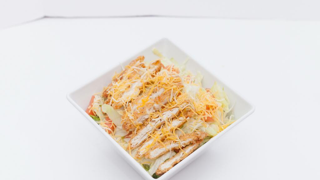 Grilled Chicken Salad · Grilled chicken, cheese, tomatoes, lettuce, shredded cheese, served with dressing.