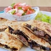 Steak Quesadilla · Hot, crisp tortilla filled with bell pepper, onions and cheddar cheese