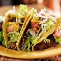 Ground Beef Taco · Juicy taco filled with meat, topped with lettuce, pico de Gallo, lettuce, sour cream, cheese...