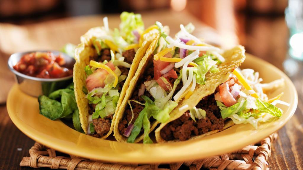 Beef Taco · Seasoned beef, served with chopped onions and cilantro on fresh corn tortillas.
