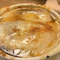 Baked French Onion Soup · Toasted baguette and melted gruyer.