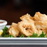 Fried Calamari · Lightly breaded and served with cocktail sauce.