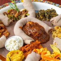 Ethio Beans Combo · Injera bread and combined portion of veggie combo, well done tebes, doro wot and tegabino sh...