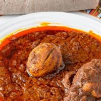 Chicken Curry (Doro Wot) · Injera bread, bone-in chicken in spicy berbere sauce with a hard boiled egg. Served with ayi...