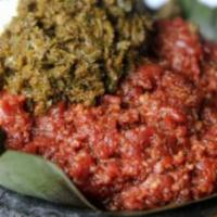 Special Kitifo · Injera, Lean fresh beef minced and lightly seasoned with a touch of seasoned butter and 'mit...