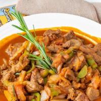 Goat Tebes · Injer bread, cubed goat lamb meat and sauteed with onions, garlic, tomatoes, sliced jalapeño...