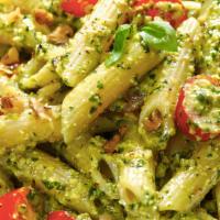Creamy Pesto Pasta · Penne noodle with a creamy basil pesto sauce served with marinated tomatoes and mushrooms.