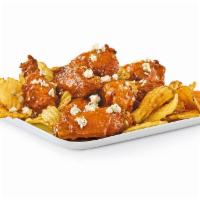 Bar Wings 'N' Yukon Chips · Bone-In Bar Wings with your choice of sauce, served on a bed of Yukon kettle chips.