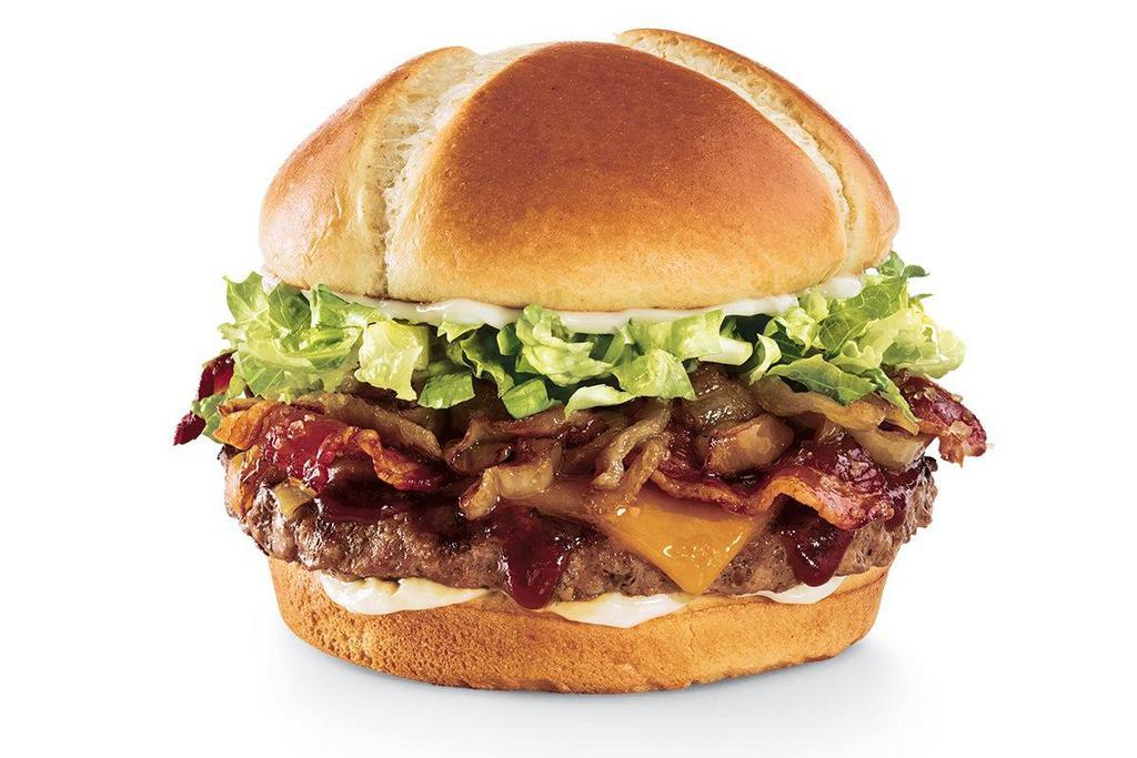 The Southern Charm Burger® · Brown sugar glaze, candied bacon, Whiskey River® BBQ Sauce, Cheddar, caramelized onions, lettuce and mayo on a toasted brioche bun.