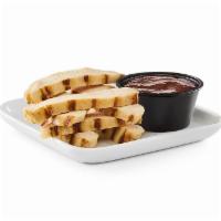 Grilled Chicken Dip'Ns · Bite-sized strips of grilled chicken breast with a side of dipping sauce..