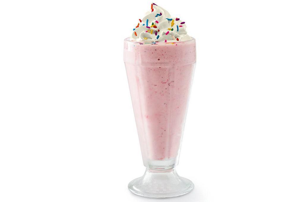 Strawberry Milkshake · Creamy soft-serve blended with milk and strawberry. Garnished with whipped cream and rainbow sprinkles.