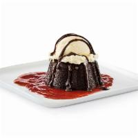 Gooey Chocolate Brownie Cake · Chocolate brownie cake with hot fudge and strawberry puree, served à la mode.. Comes cold, h...